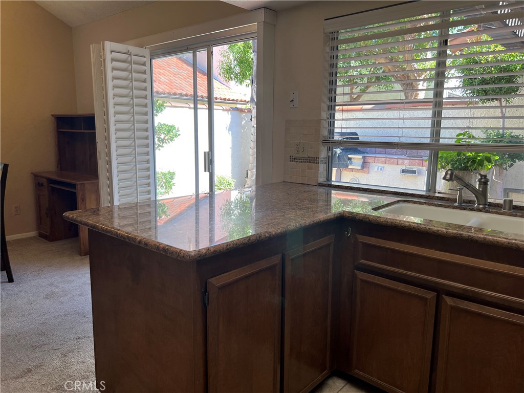 525 San Marcos Road San Dimas, CA 91773 - Photo 10 of 22 a kitchen with a sink and large window