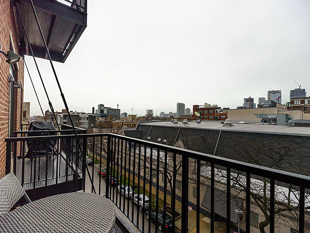 106 North Aberdeen Street, Unit 4B Chicago, IL 60607 - Photo 12 of 17 a view of city from a balcony