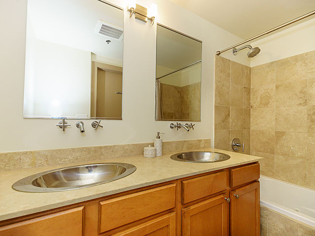 106 North Aberdeen Street, Unit 4B Chicago, IL 60607 - Photo 9 of 17 a bathroom with a sink and a mirror