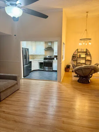 a view of a living room and kitchen