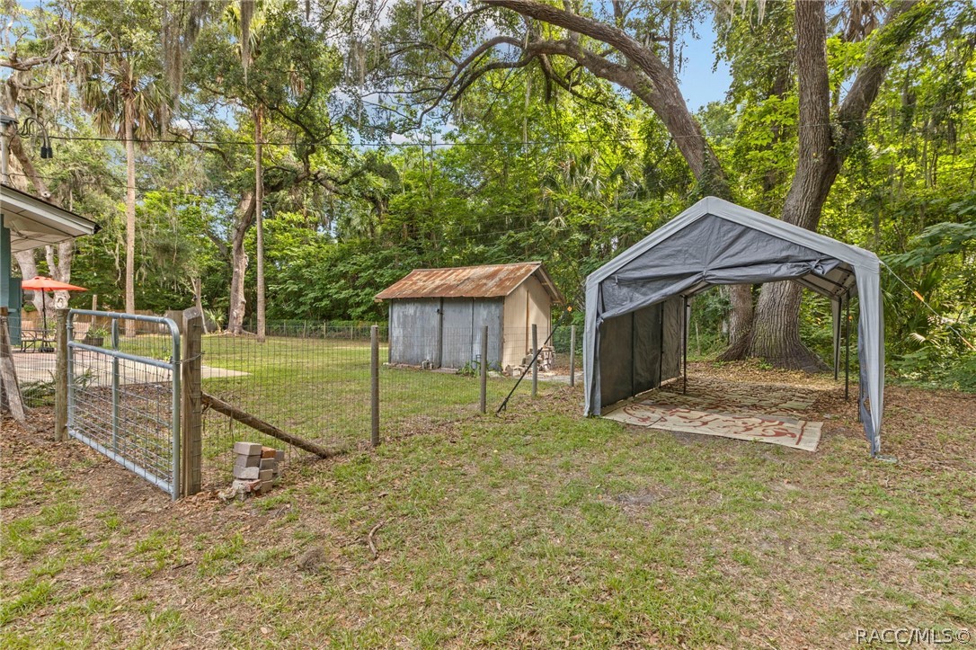 107 Allen Avenue Inglis, FL 34449 - Photo 26 of 36 a view of backyard with green space