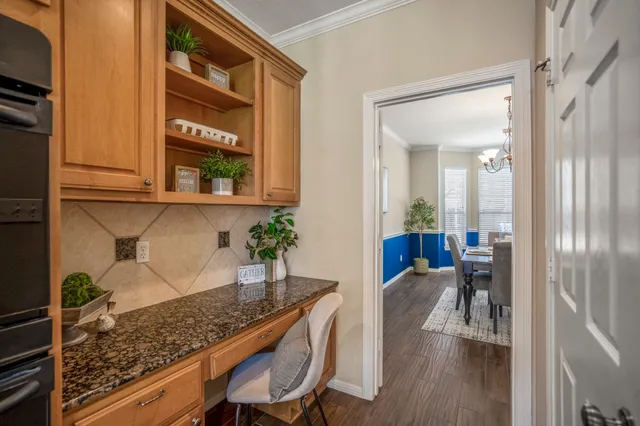 a view of a hallway and dining room