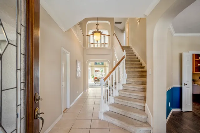 a view of entryway and hall with wooden floor