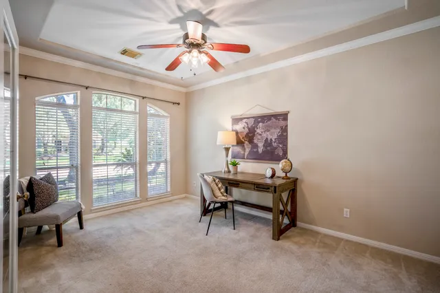 a view of a livingroom with furniture and a large window