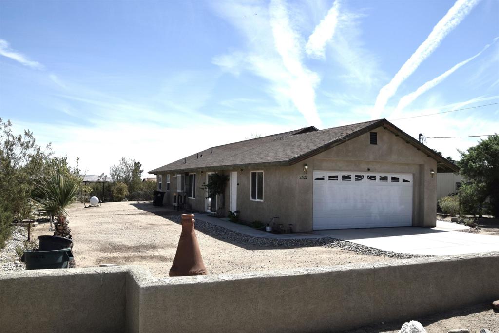 2527 Flying U Road Borrego Springs, CA 92004 - Photo 2 of 12 a front view of a house with a yard