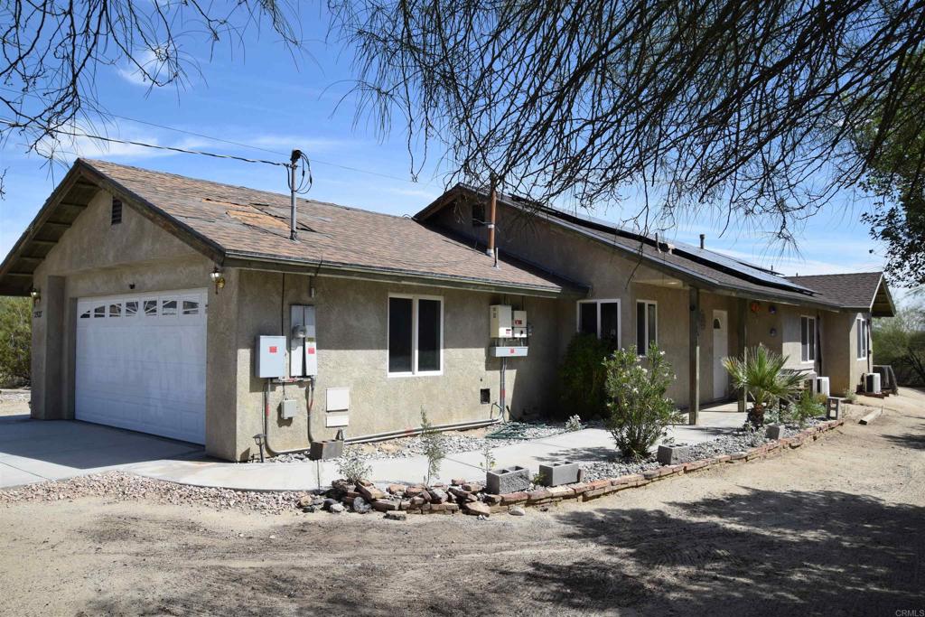 2527 Flying U Road Borrego Springs, CA 92004 - Photo 3 of 12 a front view of a house with a yard