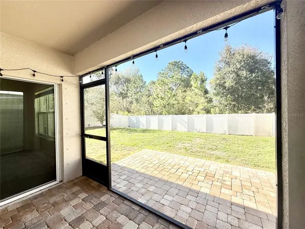 a view of a living room and window