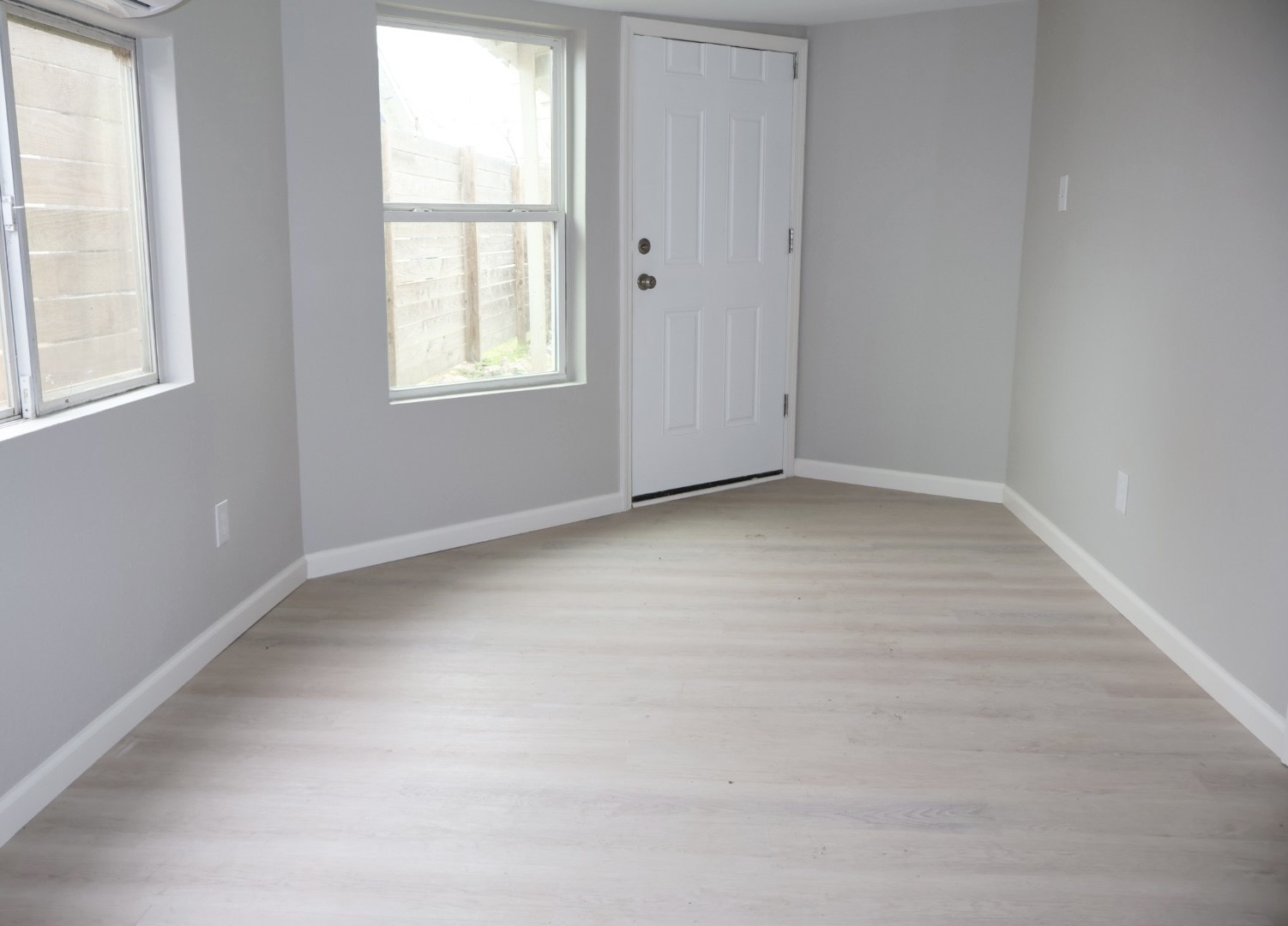 7515 Bayway Drive, Unit 5 Baytown, TX 77520 - Photo 2 of 11 an empty room with windows