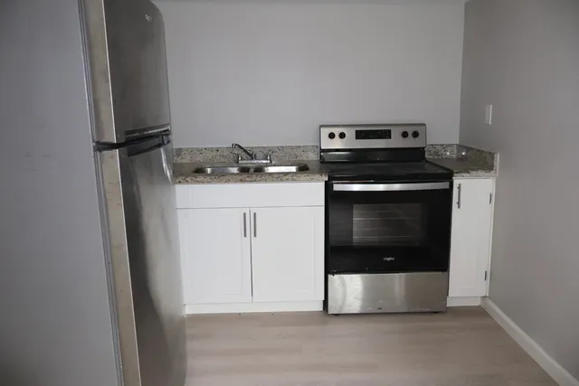 a kitchen with a stove and a microwave