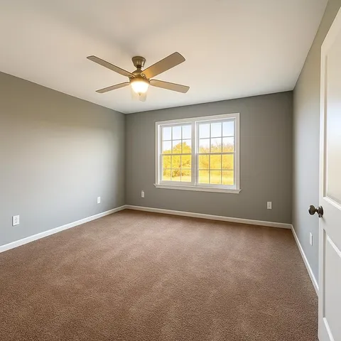 a bathroom with a granite countertop sink mirror vanity and toilet