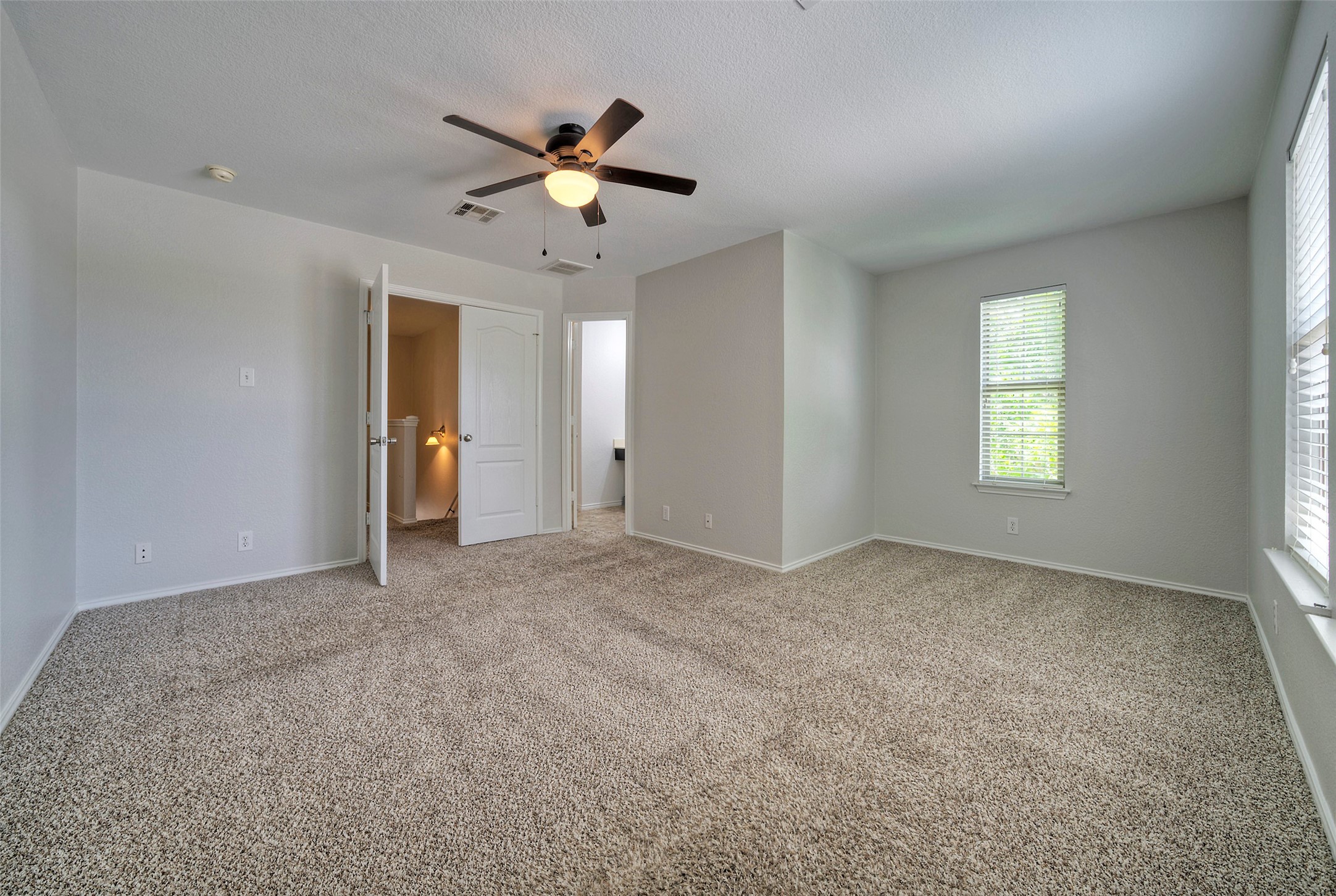 140 Plum Path Kyle, TX 78640 - Photo 8 of 22 a view of an empty room with a window