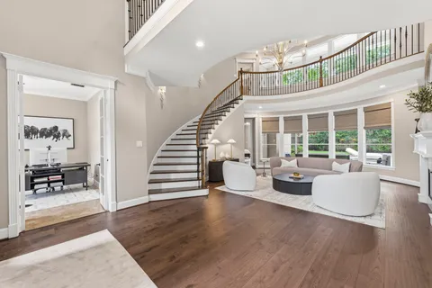 a view of an entryway with wooden floor and windows