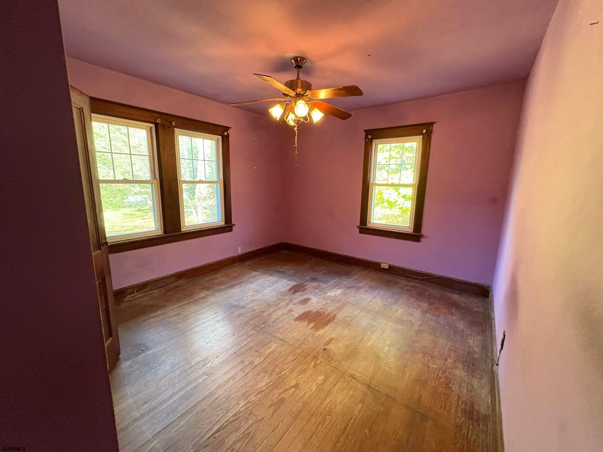 1031 Tuckahoe Road Milmay, NJ 08340 - Photo 11 of 22 a view of empty room with window and wooden floor