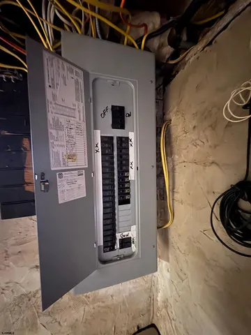 a view of water heater room with washer and dryer