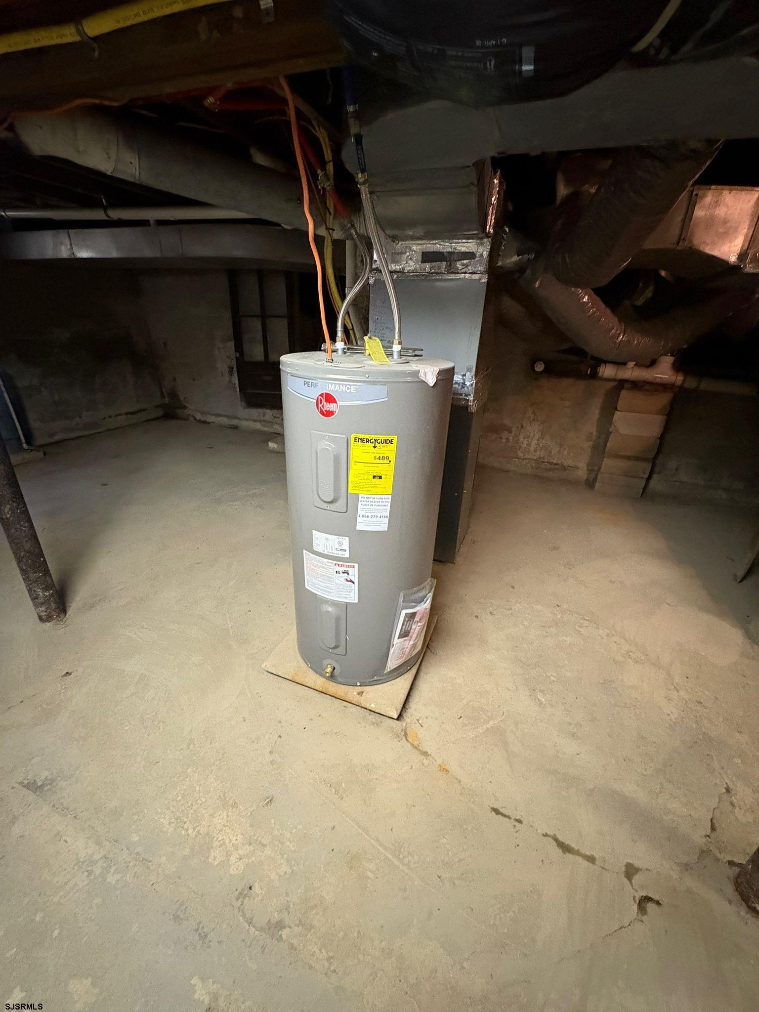 1031 Tuckahoe Road Milmay, NJ 08340 - Photo 21 of 22 a view of water heater room with washer and dryer