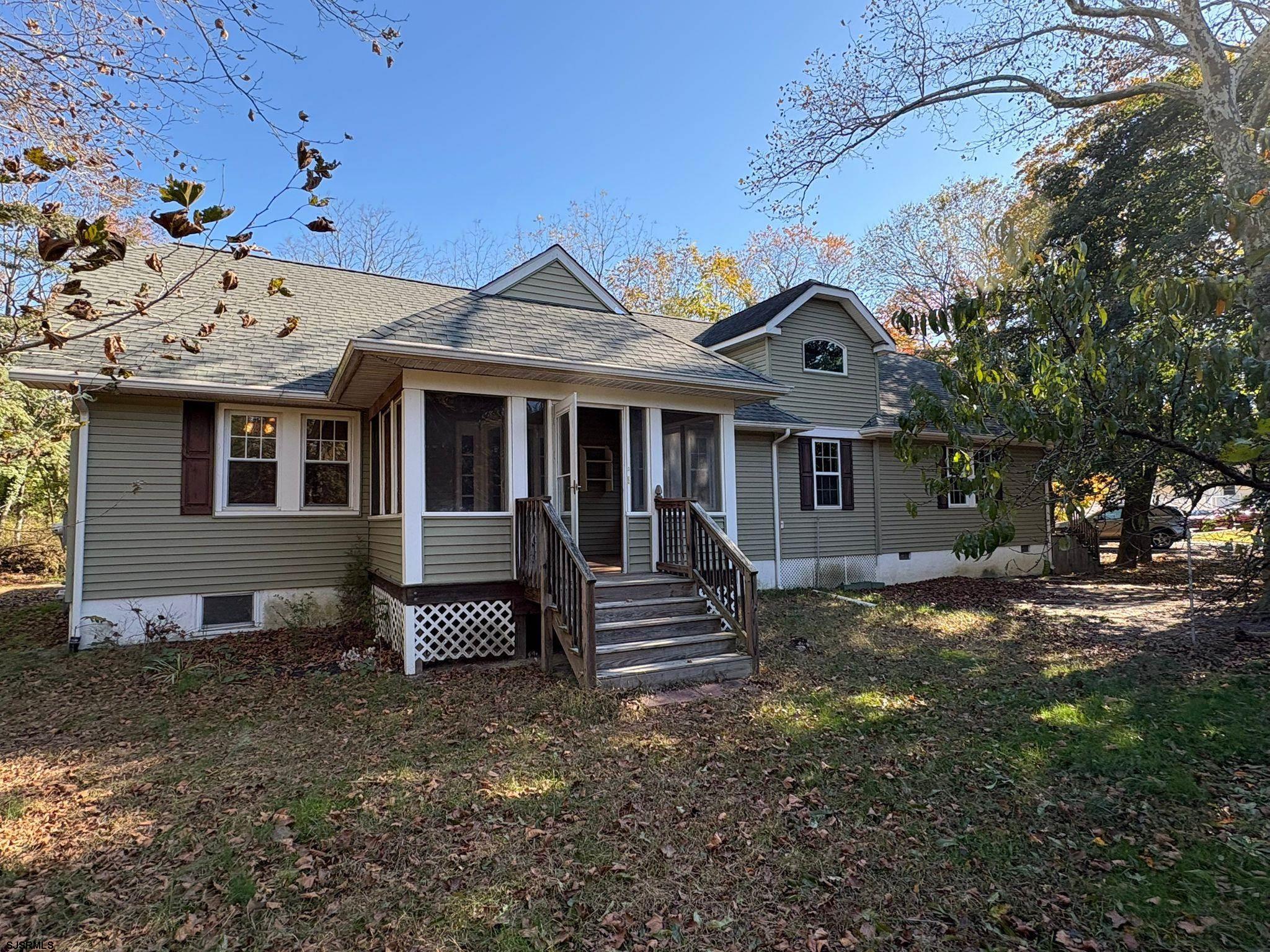 1031 Tuckahoe Road Milmay, NJ 08340 - Photo 7 of 22 a front view of a house with a garden