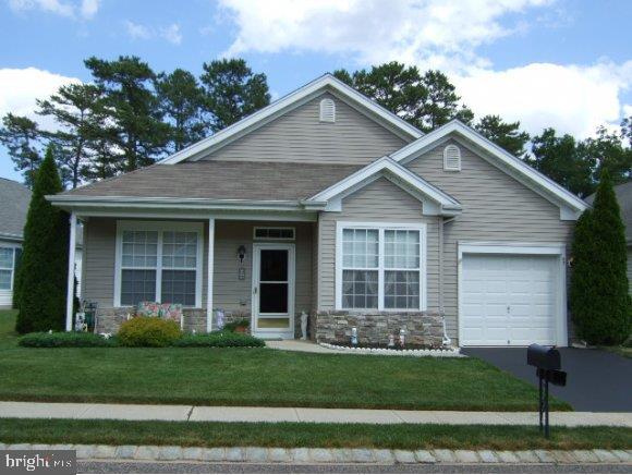 47 Quail Road Barnegat, NJ 08005 - Photo 1 of 12 a front view of a house with a garden