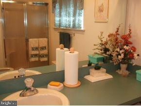 47 Quail Road Barnegat, NJ 08005 - Photo 9 of 12 a bathroom with a sink toilet and shower