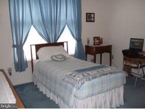 47 Quail Road Barnegat, NJ 08005 - Photo 10 of 12 a bedroom with a bed and a tv on table
