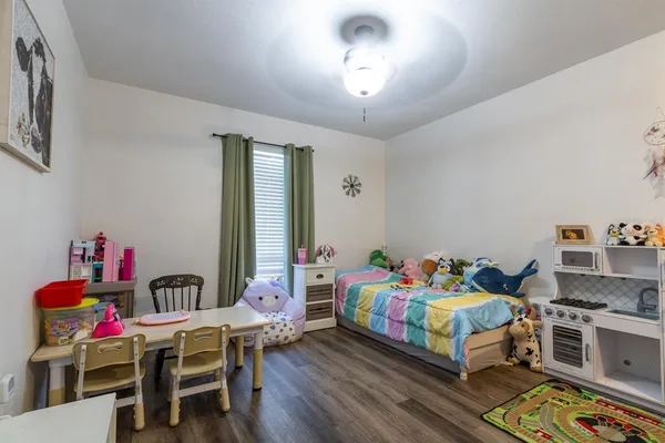 a bedroom with furniture and a chandelier