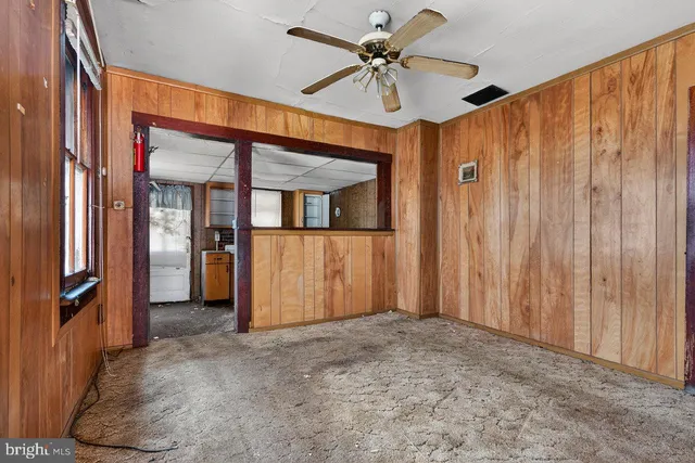 a view of a hallway with a chandelier