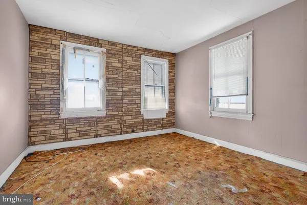 a kitchen with a sink and a refrigerator