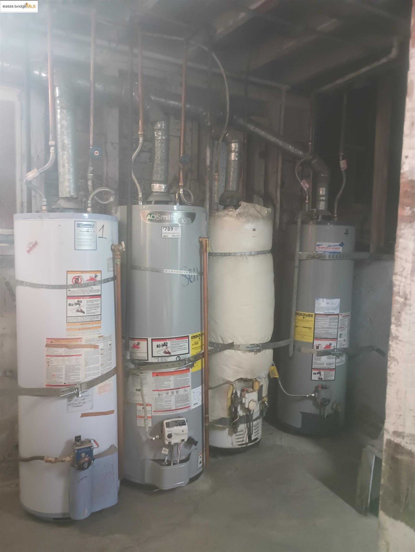 847 East 18th Street Oakland, CA 94606 - Photo 11 of 60 a room with water heater and racks