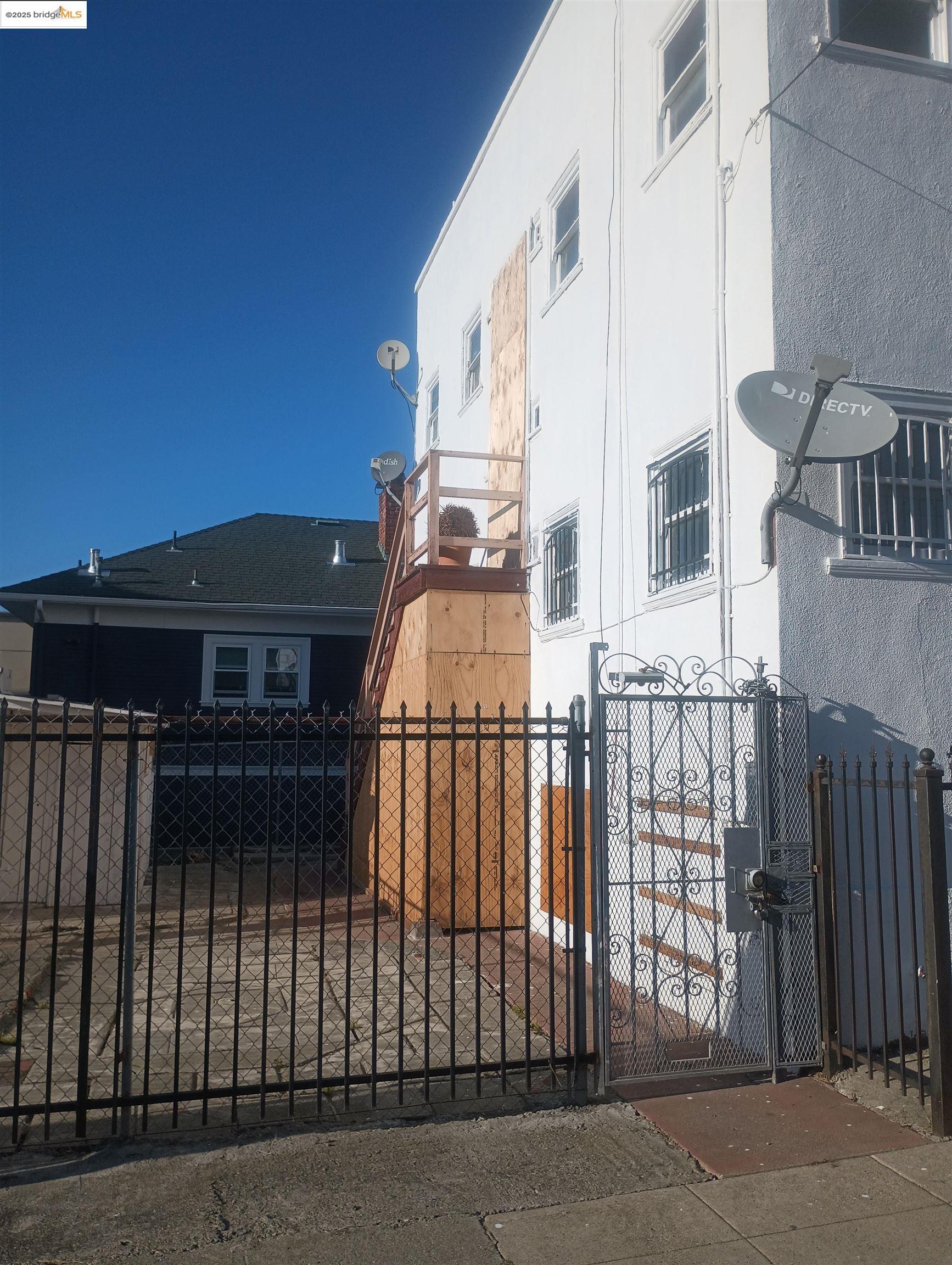 847 East 18th Street Oakland, CA 94606 - Photo 16 of 60 a view of a brick house with many windows