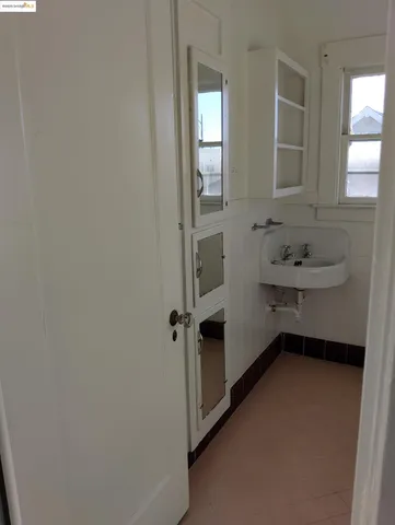 a kitchen that has a sink and a stove