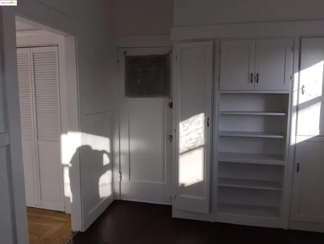 a view of front door with wooden floor