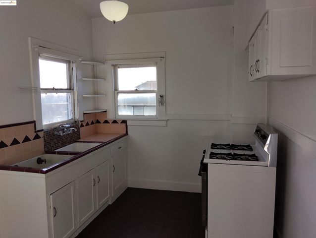 a view of an empty room and a window