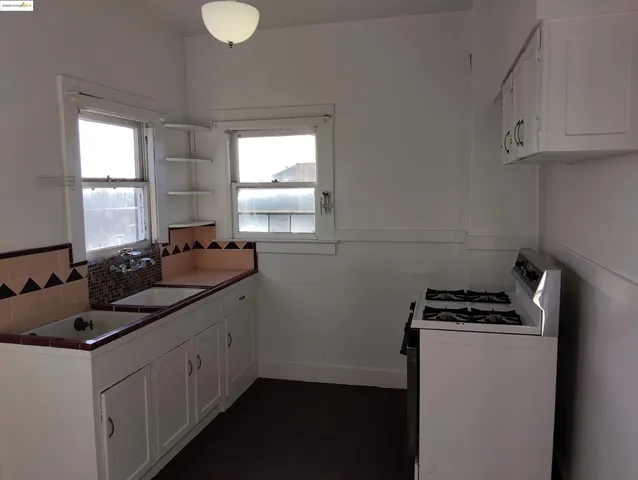 a view of an empty room and a window