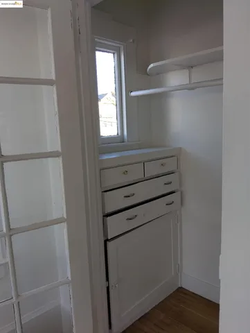 a kitchen with granite countertop a sink and a stove