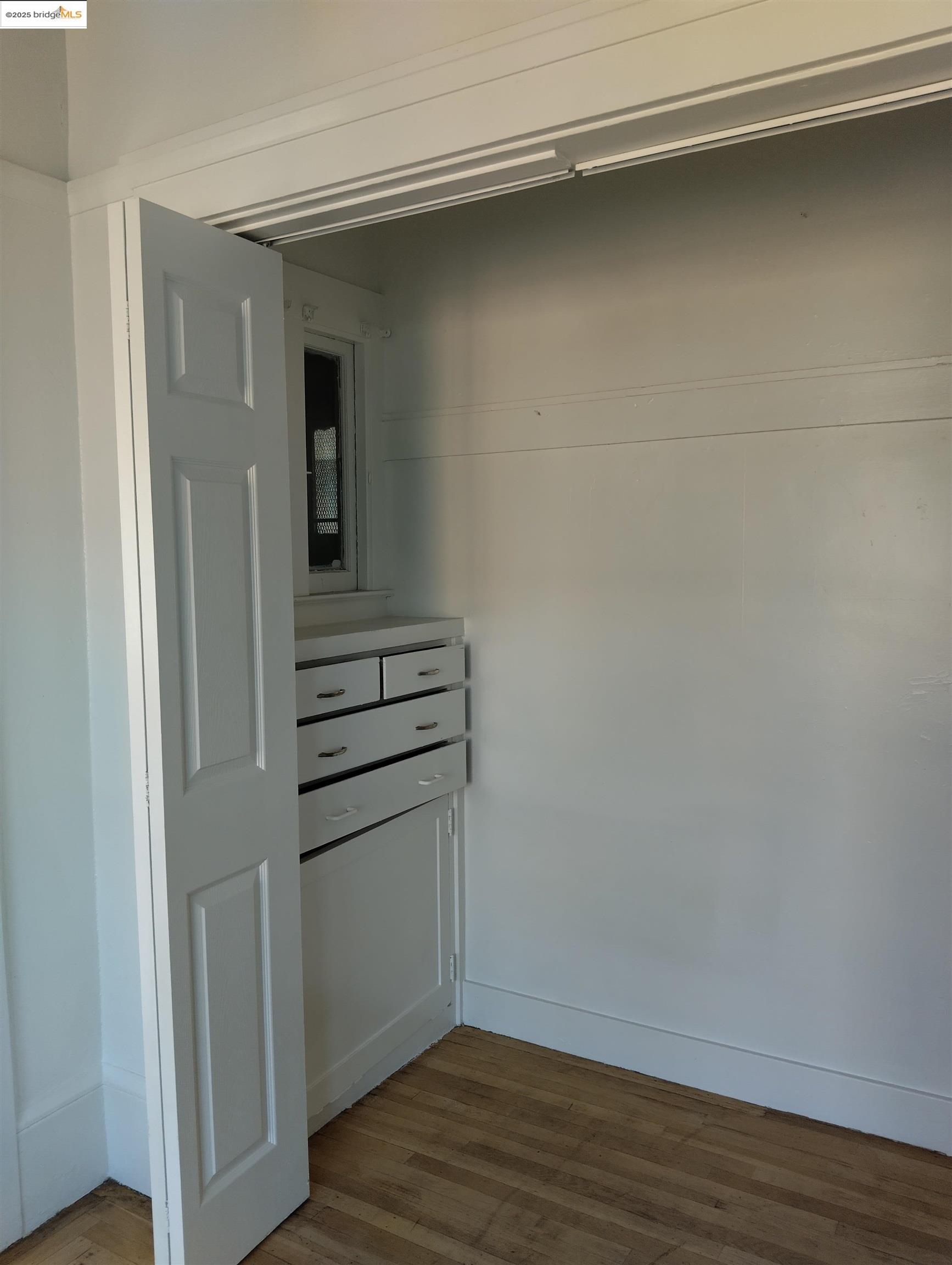 847 East 18th Street Oakland, CA 94606 - Photo 36 of 60 a view of kitchen with wooden floor and electronic appliances