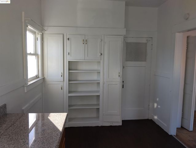 a view of front door with wooden floor