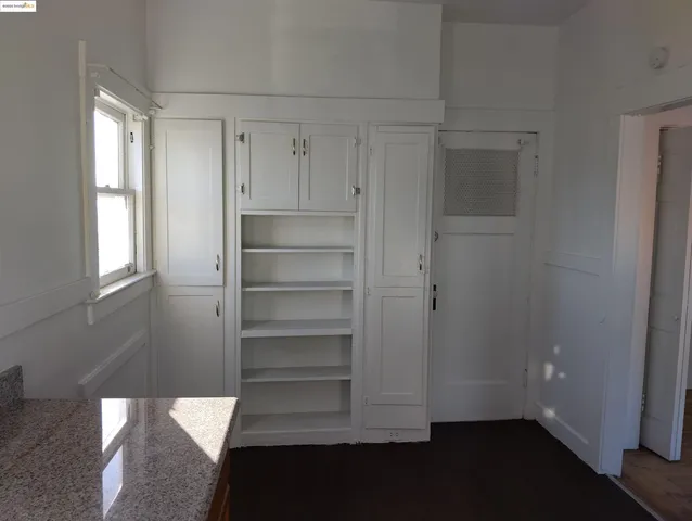 a view of front door with wooden floor