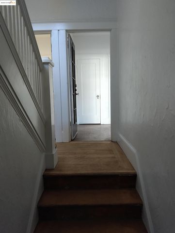 a view of wooden floor and windows in a room