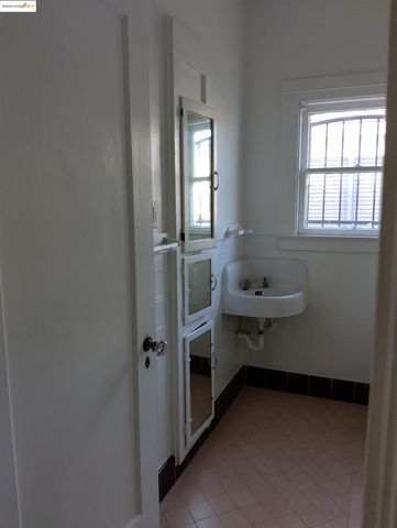 a view of a closet with wooden floor