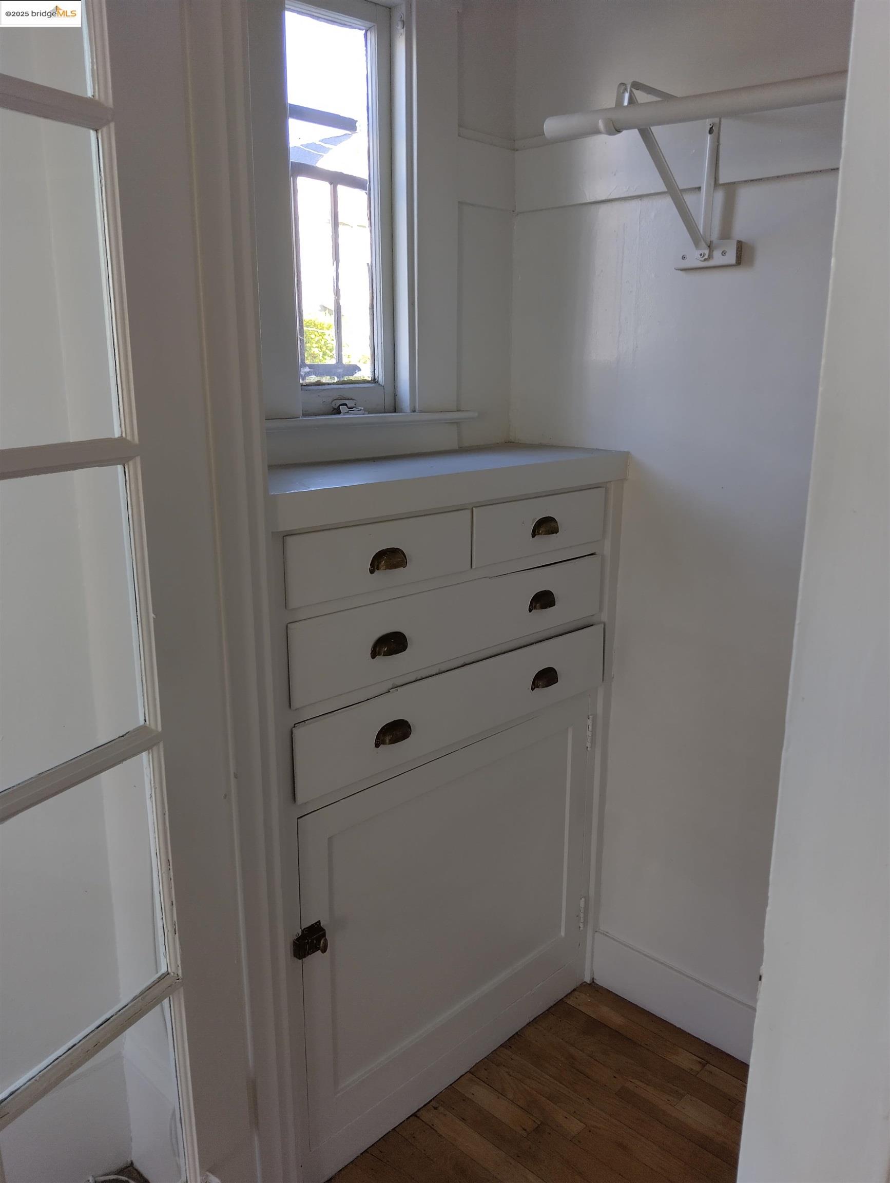 847 East 18th Street Oakland, CA 94606 - Photo 57 of 60 a view of a closet with wooden floor