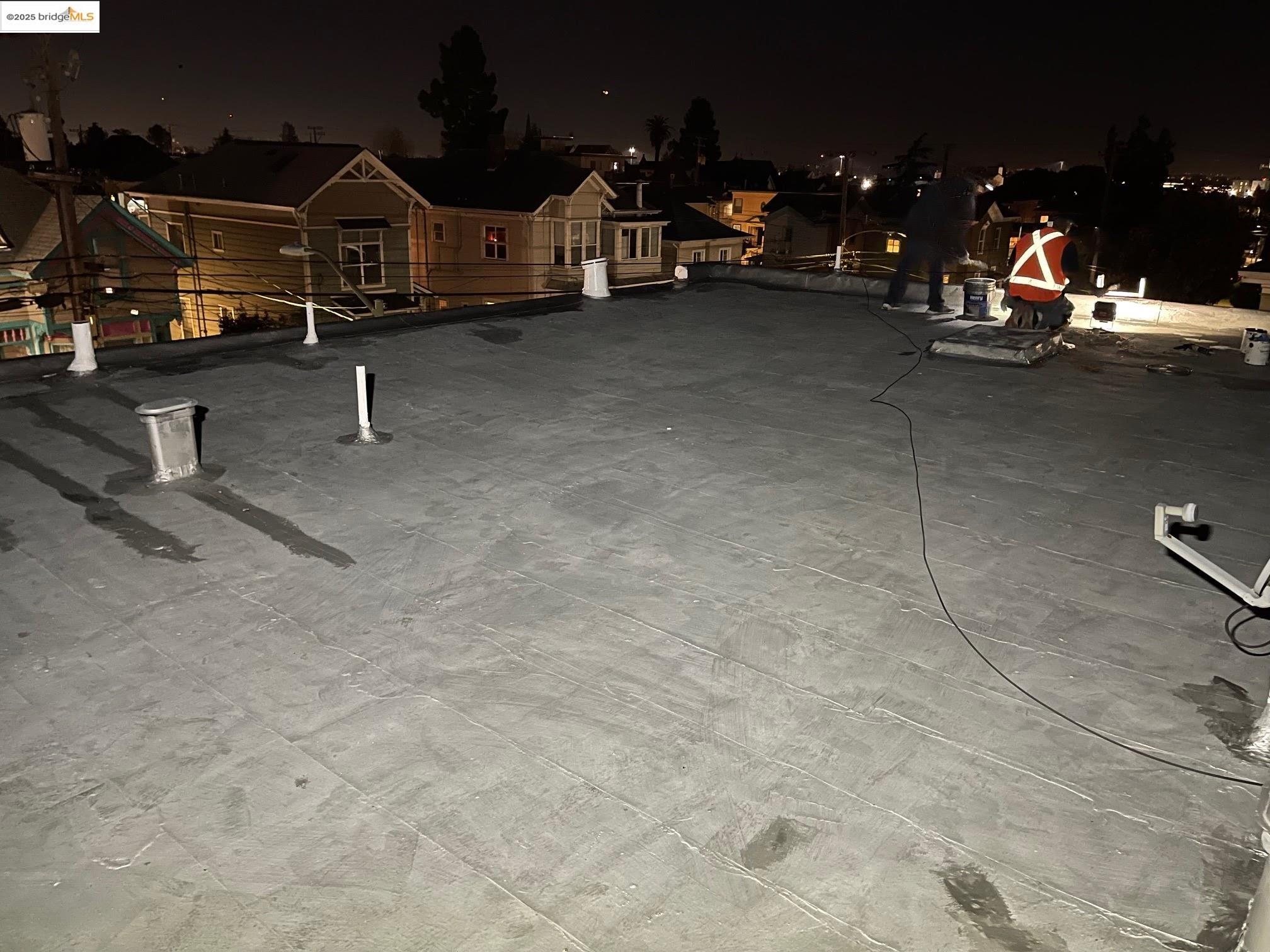 847 East 18th Street Oakland, CA 94606 - Photo 9 of 60 a view of a garage with parked cars