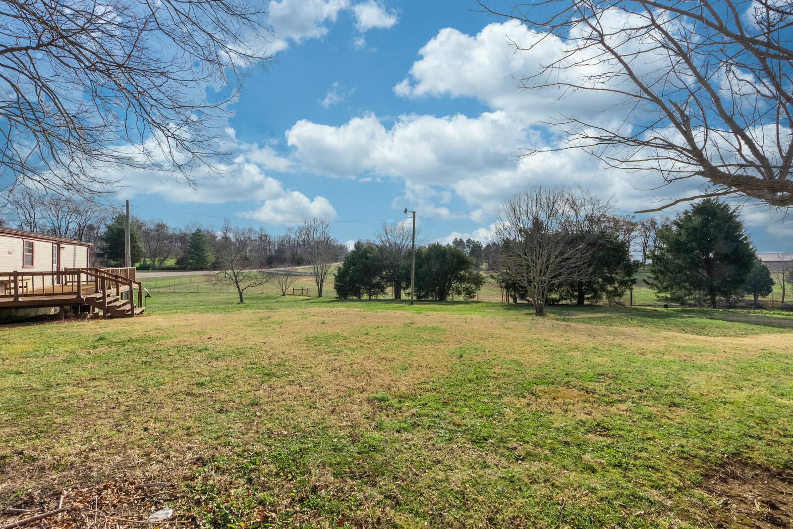 6480 Highway 161 Springfield, TN 37172 - Photo 18 of 20 a view of a field of grass and trees
