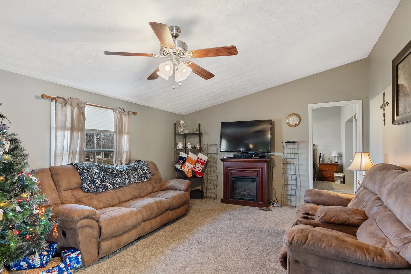 6480 Highway 161 Springfield, TN 37172 - Photo 3 of 20 a living room with furniture a flat screen tv and a fireplace