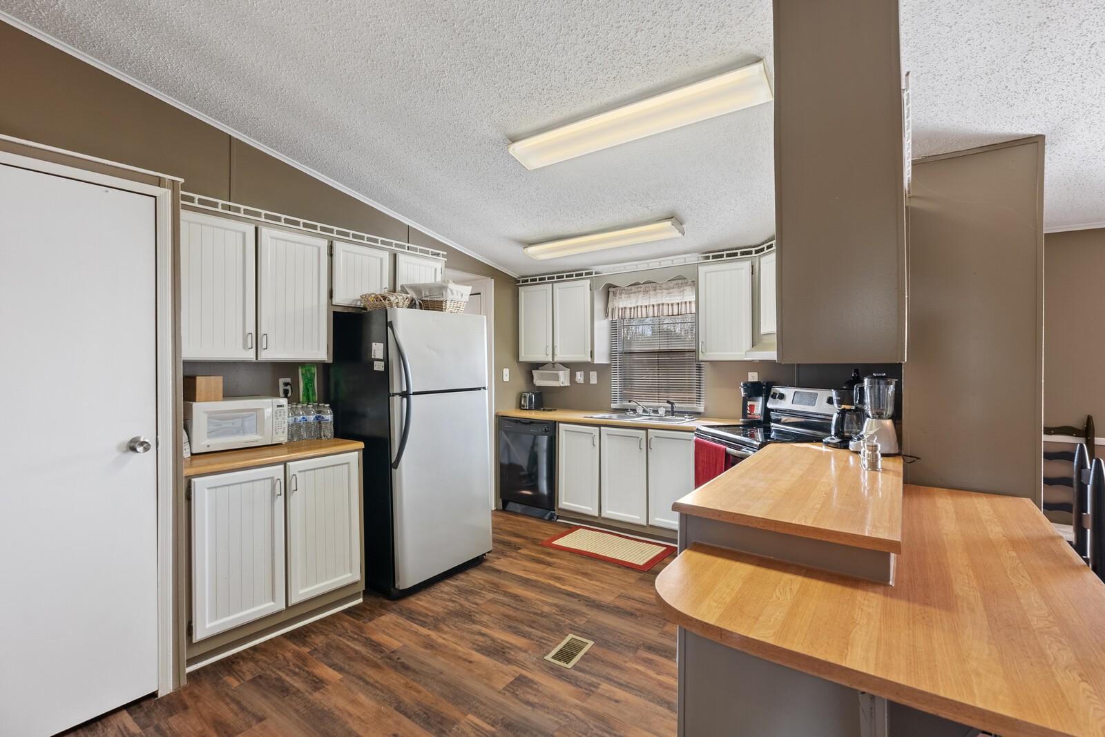 6480 Highway 161 Springfield, TN 37172 - Photo 6 of 20 a kitchen with a refrigerator and a sink