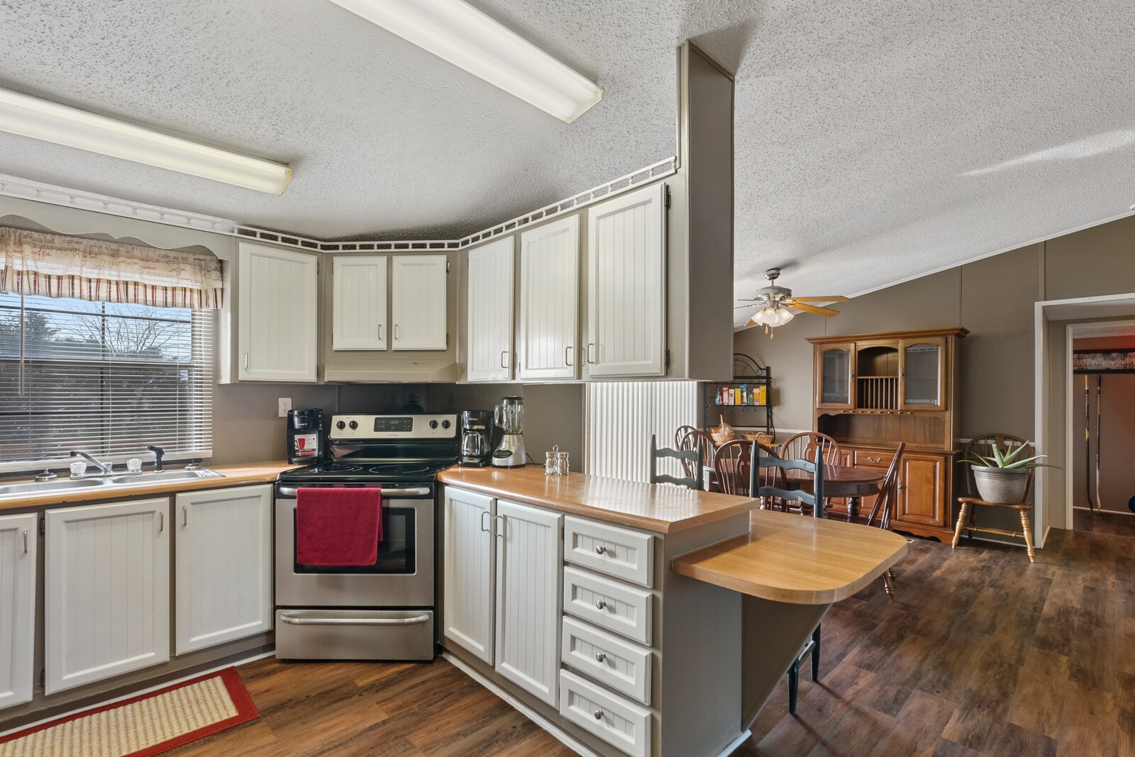 6480 Highway 161 Springfield, TN 37172 - Photo 7 of 20 a kitchen with a sink stove and cabinets
