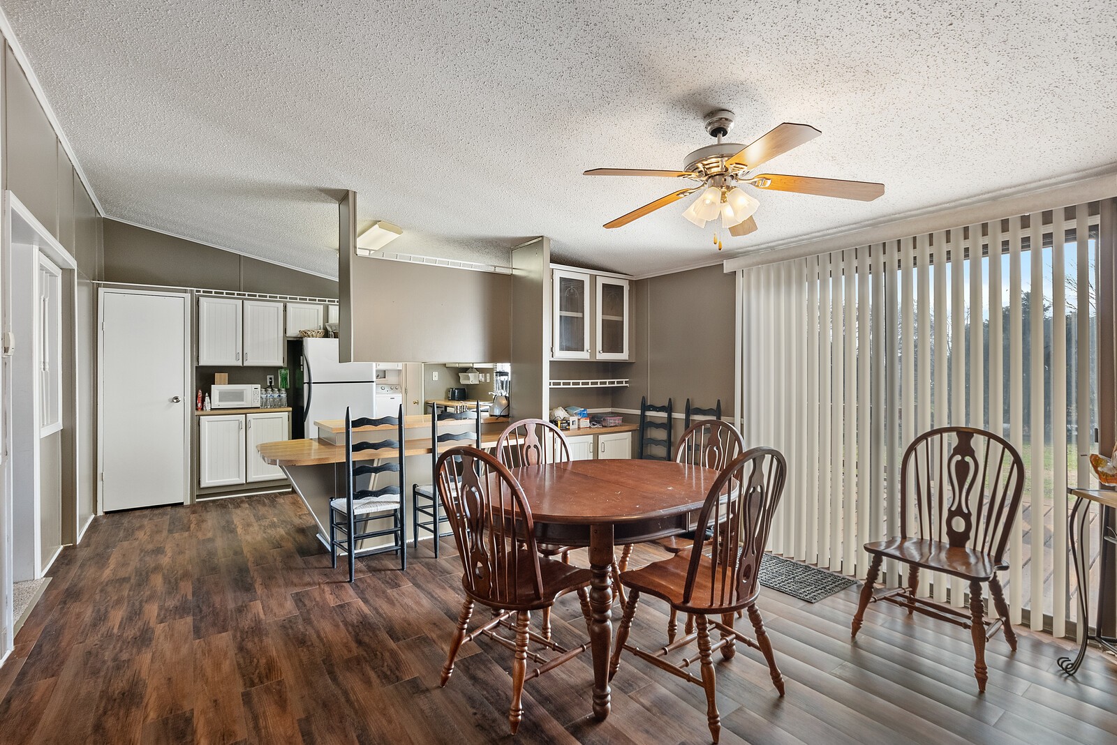 6480 Highway 161 Springfield, TN 37172 - Photo 9 of 20 a dining room with furniture a chandelier and wooden floor