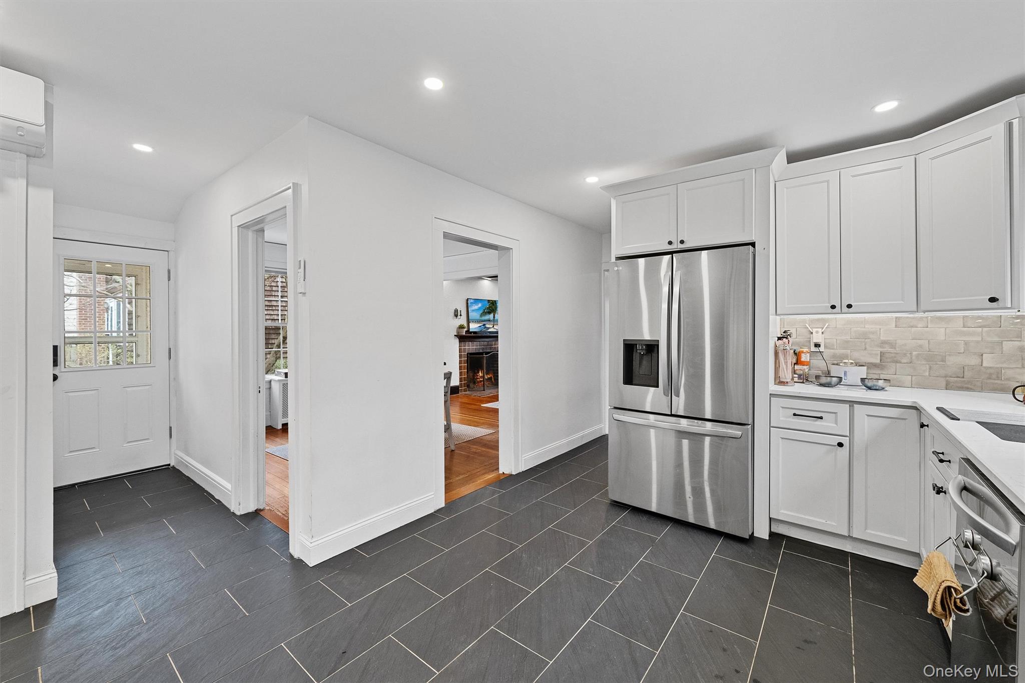 112 Ralph Avenue White Plains, NY 10606 - Photo 13 of 30 Kitchen with baseboards, recessed lighting, light countertops, white cabinetry, and stainless steel appliances