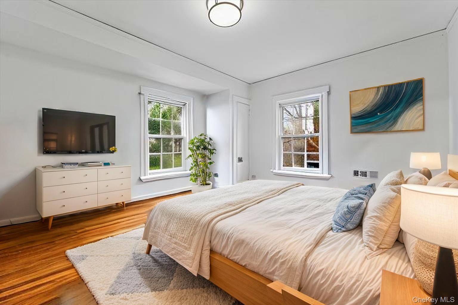 112 Ralph Avenue White Plains, NY 10606 - Photo 18 of 30 Bedroom featuring wood finished floors and baseboards