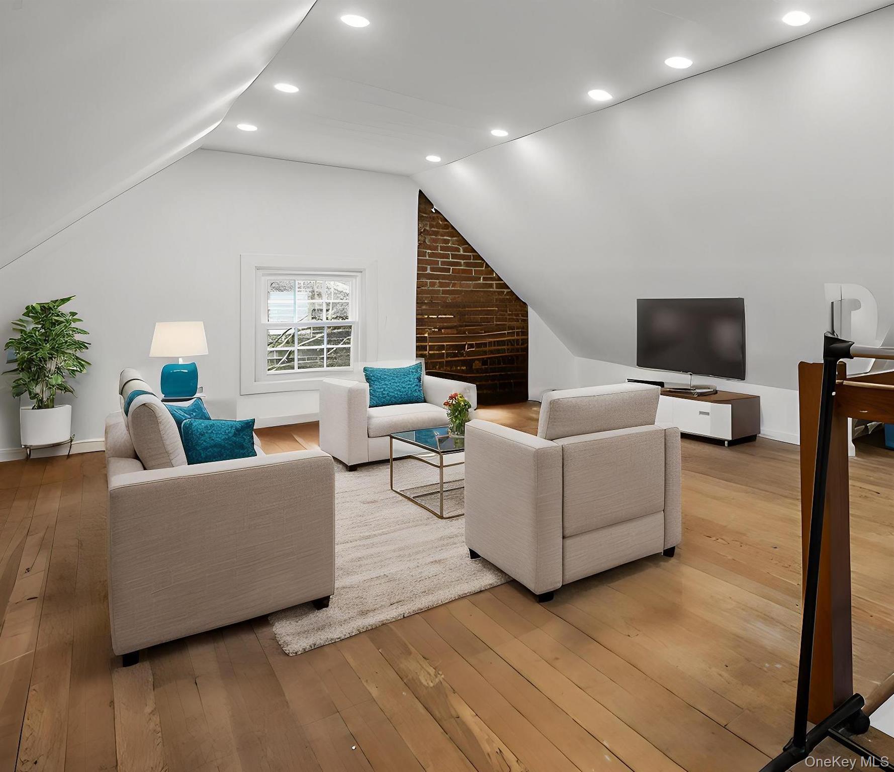 112 Ralph Avenue White Plains, NY 10606 - Photo 25 of 30 Living room with light wood finished floors, recessed lighting, and lofted ceiling