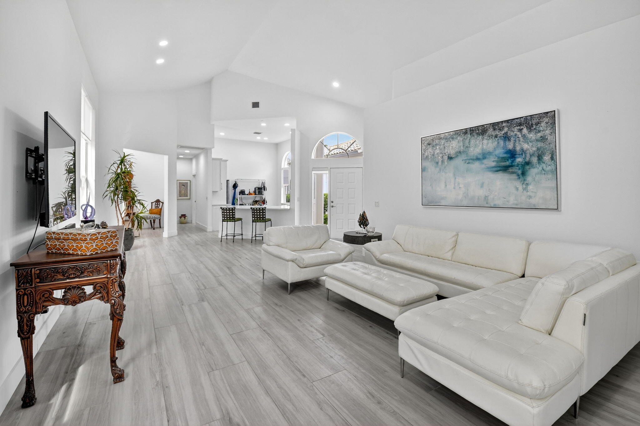 6668 Northwest 25th Terrace Boca Raton, FL 33496 - Photo 11 of 53 a living room with furniture and a flat screen tv