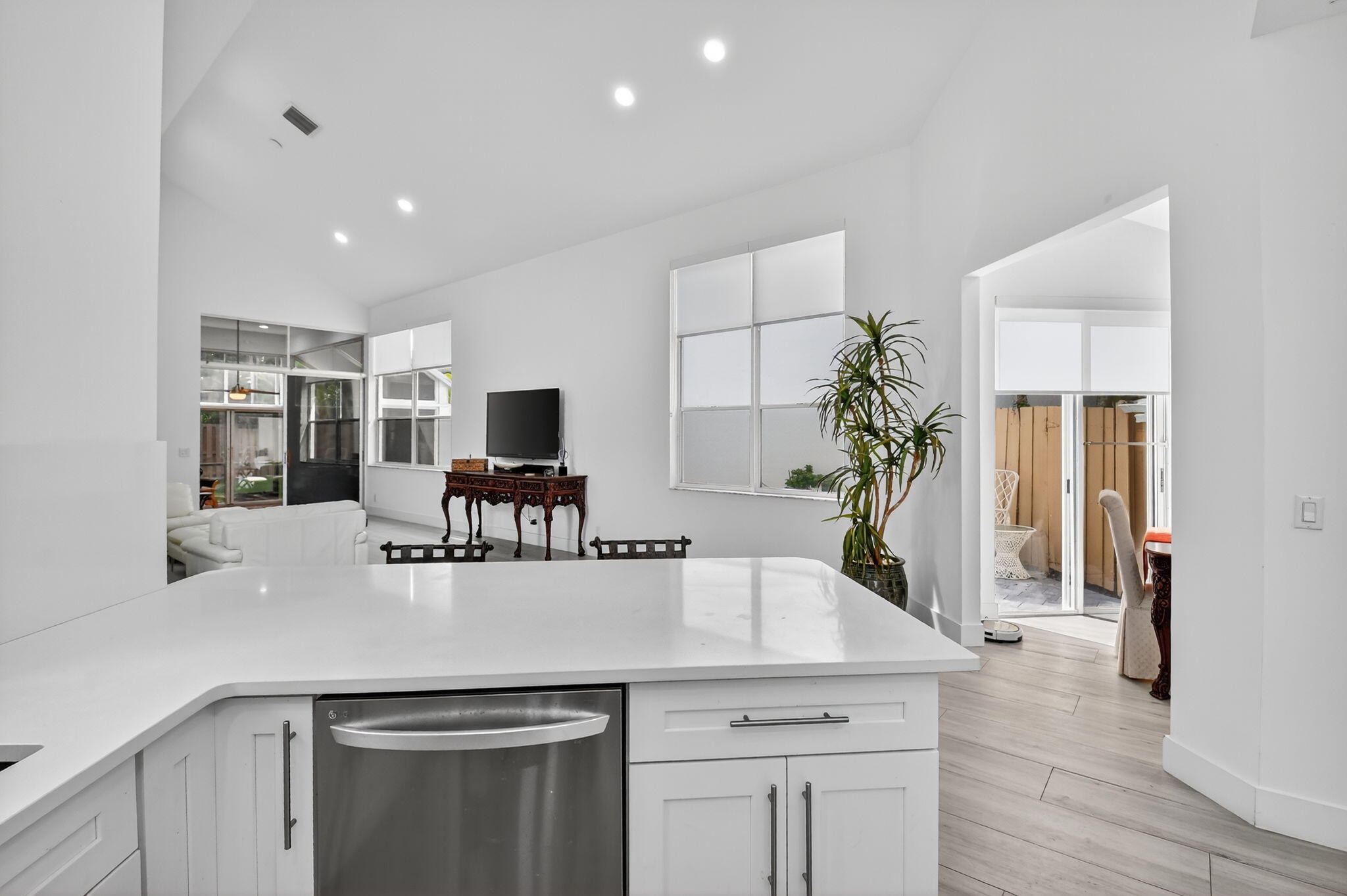 6668 Northwest 25th Terrace Boca Raton, FL 33496 - Photo 17 of 53 a kitchen with stainless steel appliances granite countertop a sink and a refrigerator